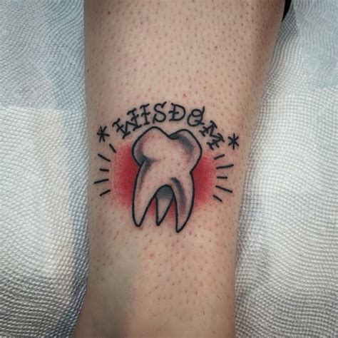 traditional tooth tattoo|teeth tattoo meaning.